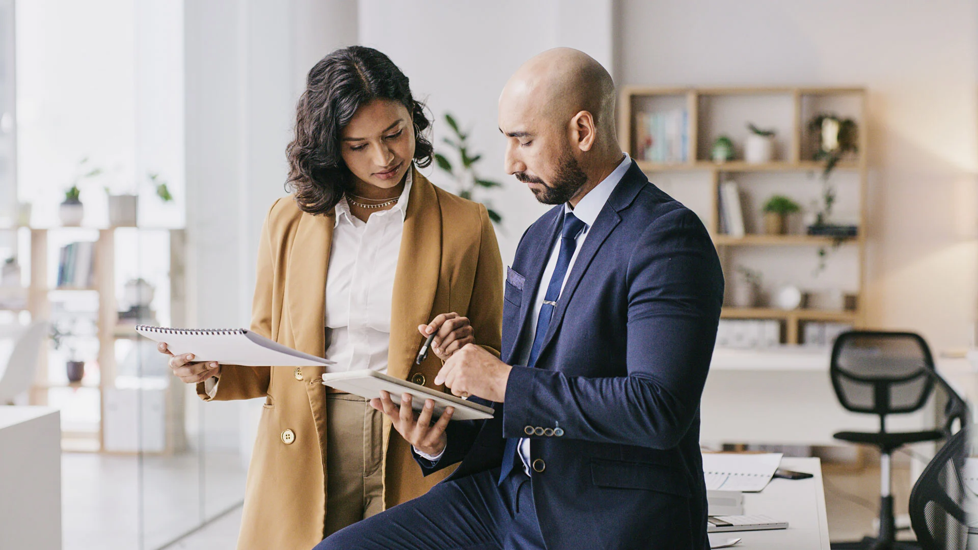 Two business people looking at a tablet
